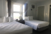 2 beds with white blankets
