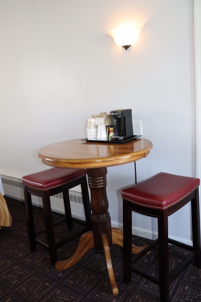 Deluxe Room table with barstools and coffee maker