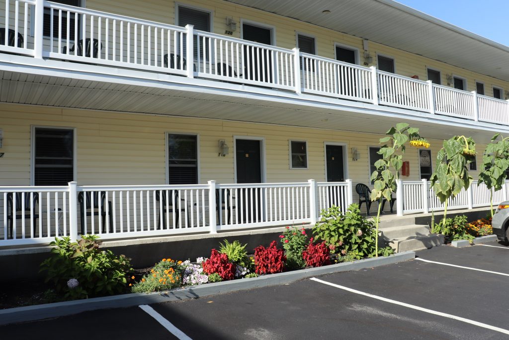 Motel entrances with flower gardens